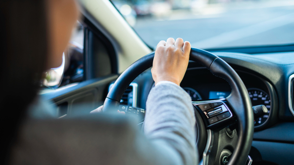 image shot from backseat of woman driving with no license in Corpus Christi, Texas